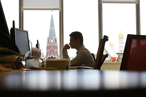 An employee works in the offices of the OAO Moscow Exchange during an event to mark the listing of Yandex NV, Russia's largest search-engine operator, at the Moscow exchange in Moscow, Russia, on Tuesday, June 3, 2014. Yandex added a Moscow stock listing, broadening its investor base and conforming with the government's campaign to get local companies to cut dependence on foreign bourses