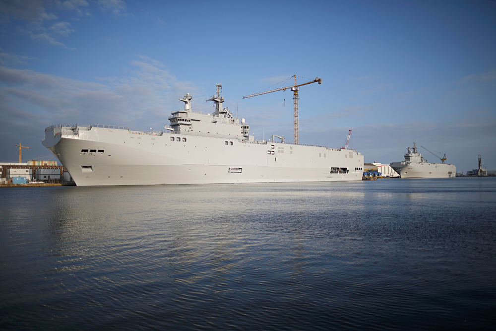 Two Mistral-class helicopter carriers Sevastopol (L) and Vladivostok are seen at the STX Les Chantiers de l'Atlantique shipyard site in Saint-Nazaire, western France, May 21, 2015. Russia wants 1.163 billion euros ($1.32 billion) in compensation from France for cancelling a contract to deliver two Mistral helicopter carriers, a Russian source close to the negotiations said last week. Picture taken May 21, 2015.
