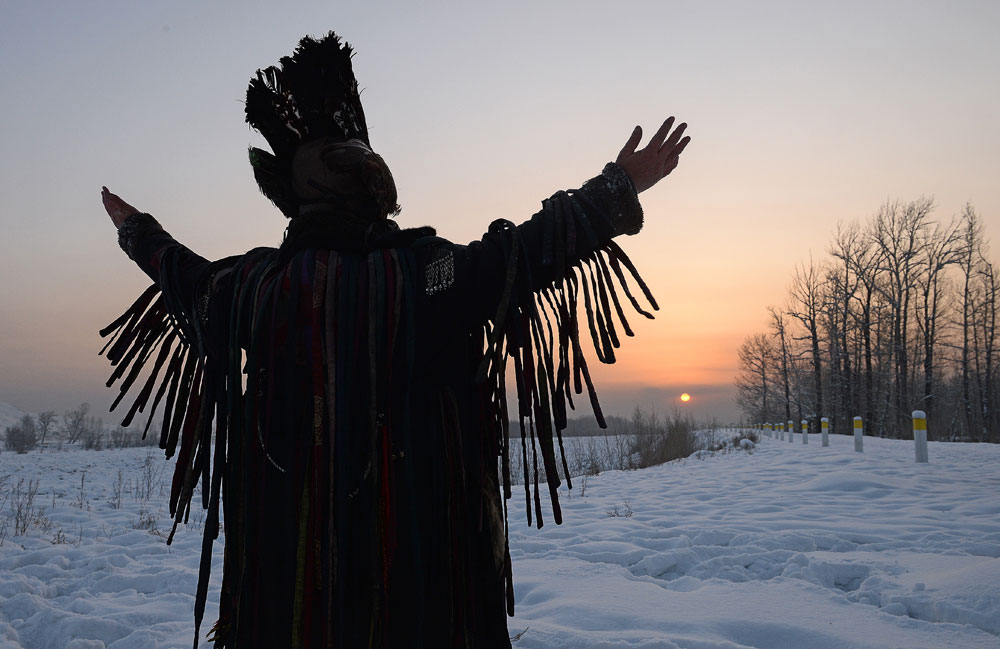 A shaman conducts the San Salyr rite at an ethnic park of culture and leisure on the bank of the Yenisei River in Kyzyl, the capital of Tyva. This rite welcomes the Sun whose first rays mark the beginning of Shagaa -- Lunar New Year.