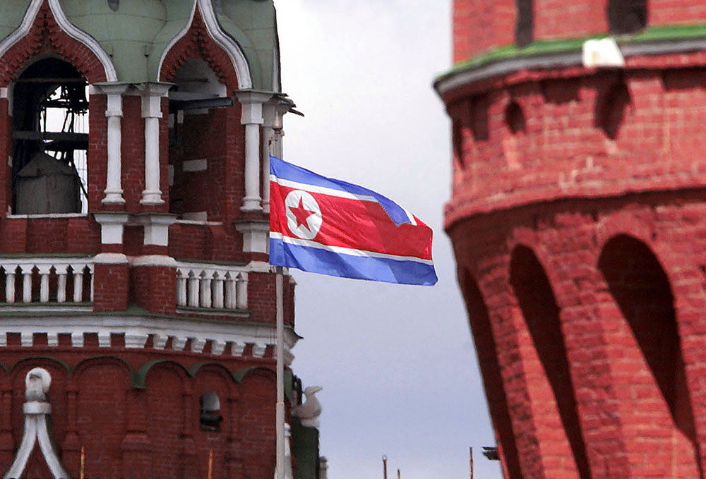 The North Korean flag flies between towers on the walls of Moscow's Kremlin.