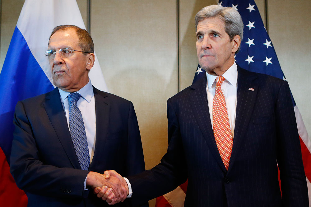 Russian Foreign Minister Sergey Lavrov and U.S. Secretary of State John Kerry shake hands prior to bilateral talks in Munich, Germany, Feb.11. The United States, Russia and other members of the International Syrian Support Group have agreed to introduce a ceasefire in Syria.