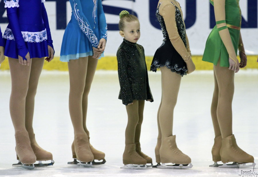 A young figure skater during a competition.