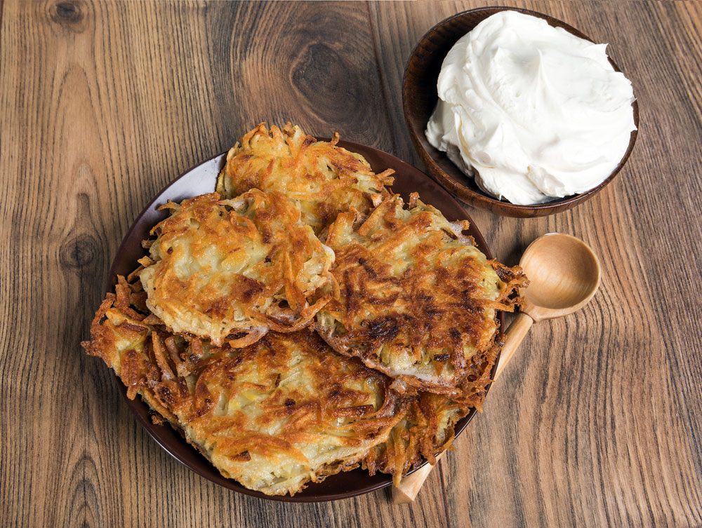 Draniki are thick pancakes made from grated potatoes, eggs and flour.
