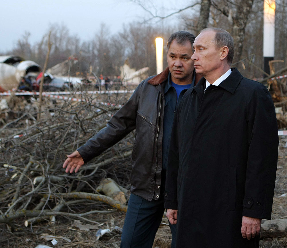 Russian Prime Minister Vladimir Putin, right, and Emergency Situations Minister Sergei Shoigu inspecting the Polish Air Force Tu-154 plane crash site near the Severny airport outside Smolensk on April 10, 2010.