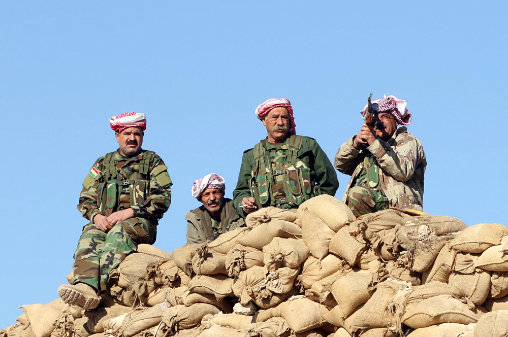 Members of the Kurdish peshmerga forces gather in the town of Sinjar, Iraq, Nov. 13, 2015.