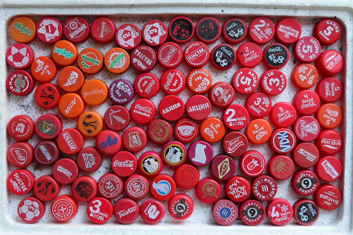 There are 8,000 bottle caps in Nikolai’s collection. They are organized according to color.