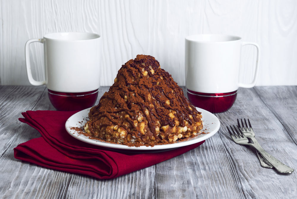 Muraveynik topped with cocoa powder looks like a real anthill.