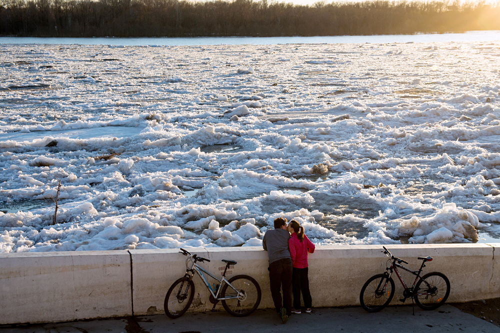 Ice breaks on Irtysh river in Omsk Region.  People walk along the Irtysh river in Omsk.