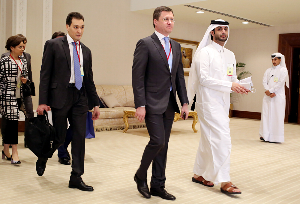 Russian Energy Minister Alexander Novak, center, arrives at an oil-producers' meeting in Doha, Qatar, on  April 17, 2016. 