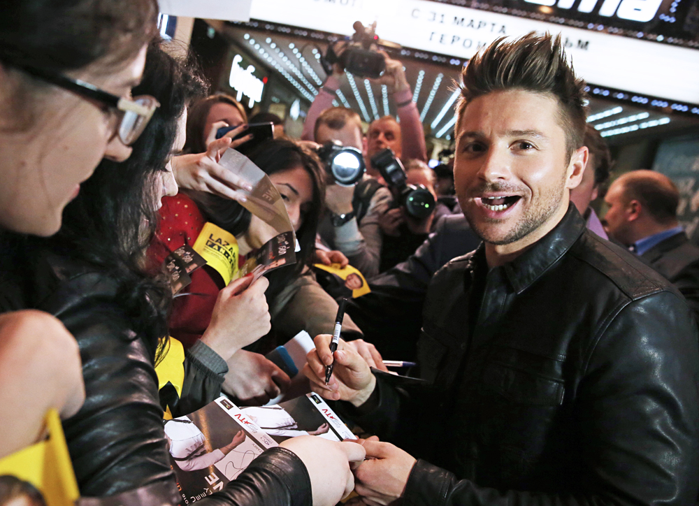 Russian singer Sergey Lazarev signs autographs, Moscow Region. 