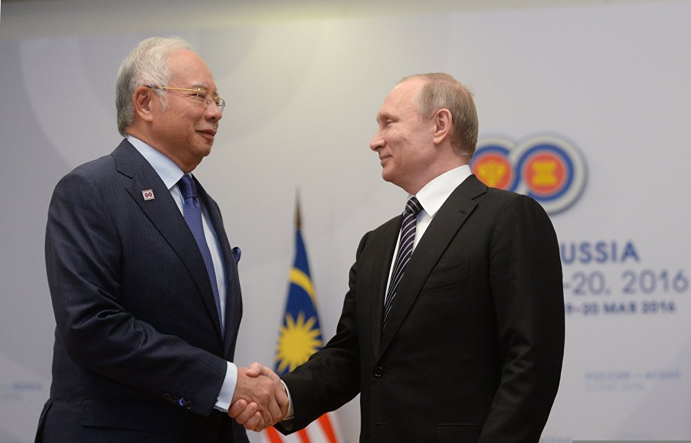 Prime Minister of Malaysia  Najib Razak (L) and President of Russia Vladimir Putin (R).