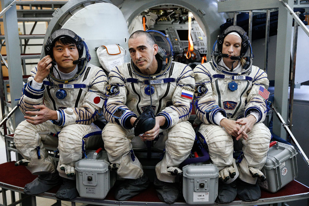 Expedition 48/49 main crew members, austronaut Takuya Onishi (JAXA), cosmonaut Anatoly Ivanishin (Roscosmos), and astronaut Kathleen Rubins (NASA), from left, in spacesuits training for the upcoming mission to the International Space Station, at the Yuri Gagarin Cosmonaut Training Centre in Zvyozdny Gorodok, Moscow Region. The launch of Expedition 48/49 aboard the Soyuz MS-01 spacecraft to the ISS is scheduled for June 2016