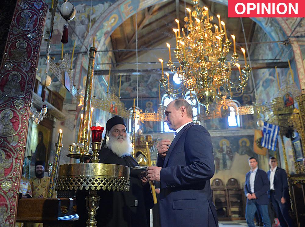 Russian President Vladimir Putin during a prayer service at the Assumption Cathedral.
