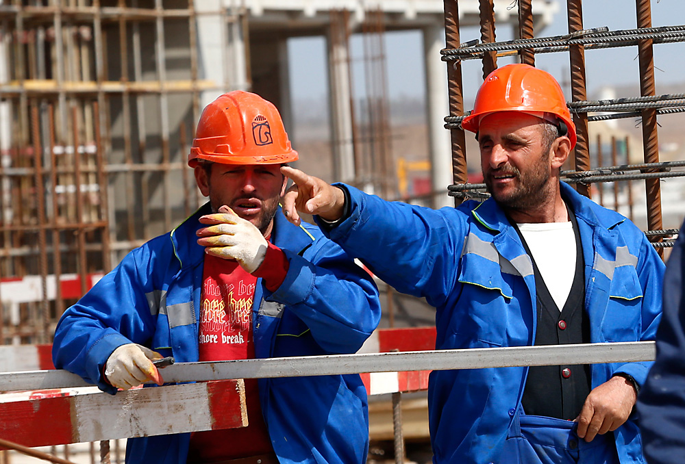Workers at the construction site of the Yuzhny Airport's passenger terminal, Rostov-on-Don, April 2016.
