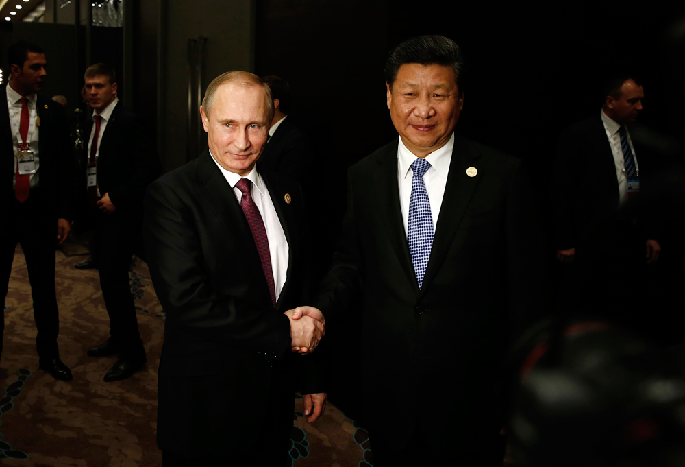 Presiden Rusia Vladimir Putin (kiri) dan Presiden Tiongkok Xi Jinping.