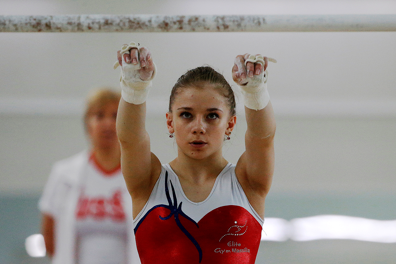 Member of the women's gymnastics Russian Olympic team Evgeniya Shelgunova attends a training session at the Ozero Krugloe (Round Lake) training centre outside Moscow, Russia