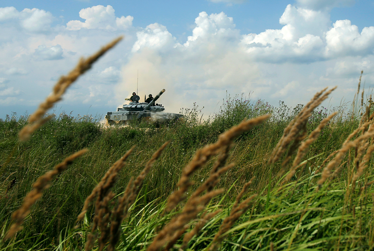 A T-72 tank, operated by a crew from Russia, drives during the Tank Biathlon competition, part of the International Army Games 2016, at a range in the settlement of Alabino outside Moscow, Russia, August 2, 2016