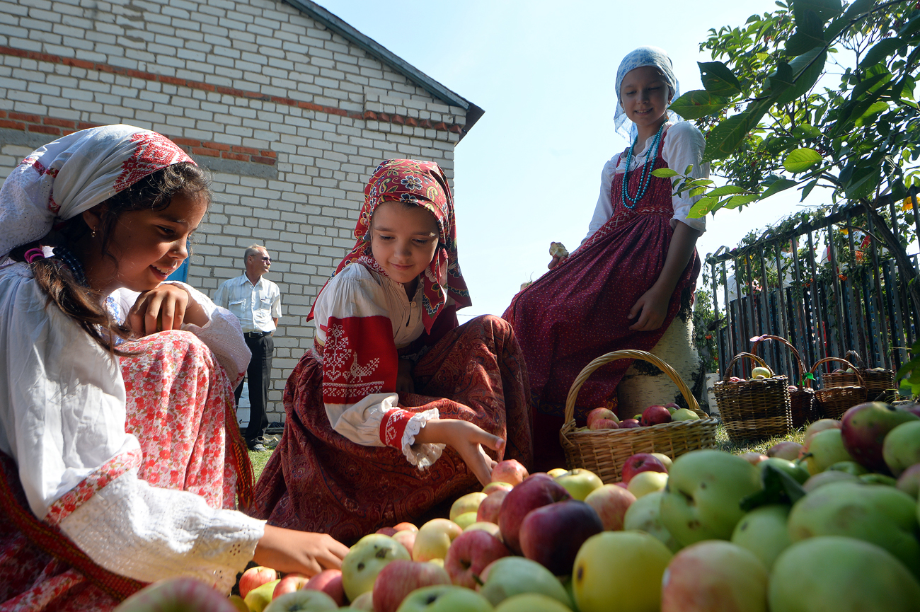 Young girls attend the feast of the Transfiguration of the Savior at Gorky Museum in the village of Krasnovidovo in the Kamsko-Ustyinsky district of Tatarstan