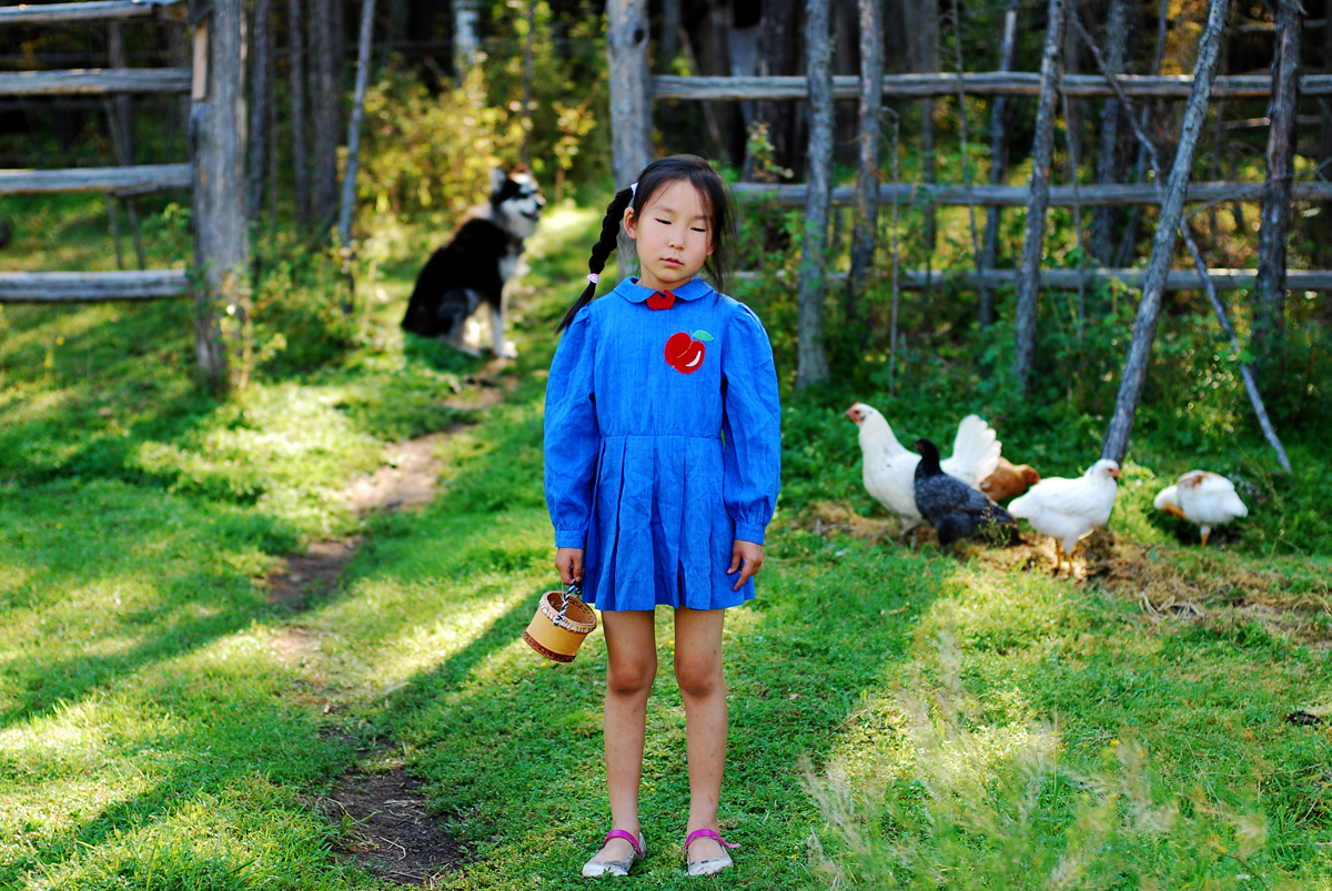 The series consists of staged photos shot during the summer by Ayar Kuo in Yakutia, her motherland, with a small girl who slightly reminds the author of herself when she too was growing up in this land.