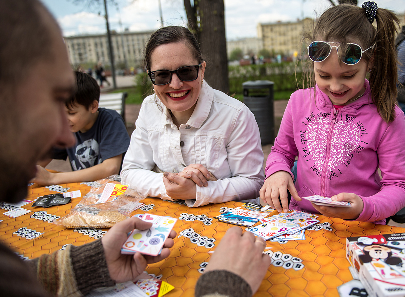 Muscovites play board games at the Central Gorky Park, Moscow.