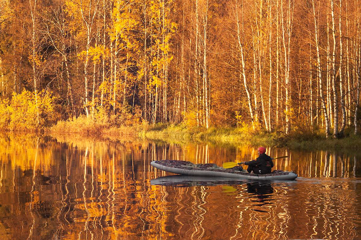 Rafting in Karelian river in fall.
