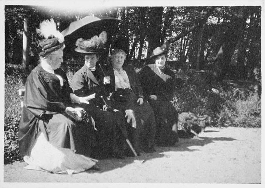 Around 700,000 people received help at Maria Fyodorovna’s hospitals, orphanages, and schools. / Maria Fyodorovna in a garden with women charity workers.