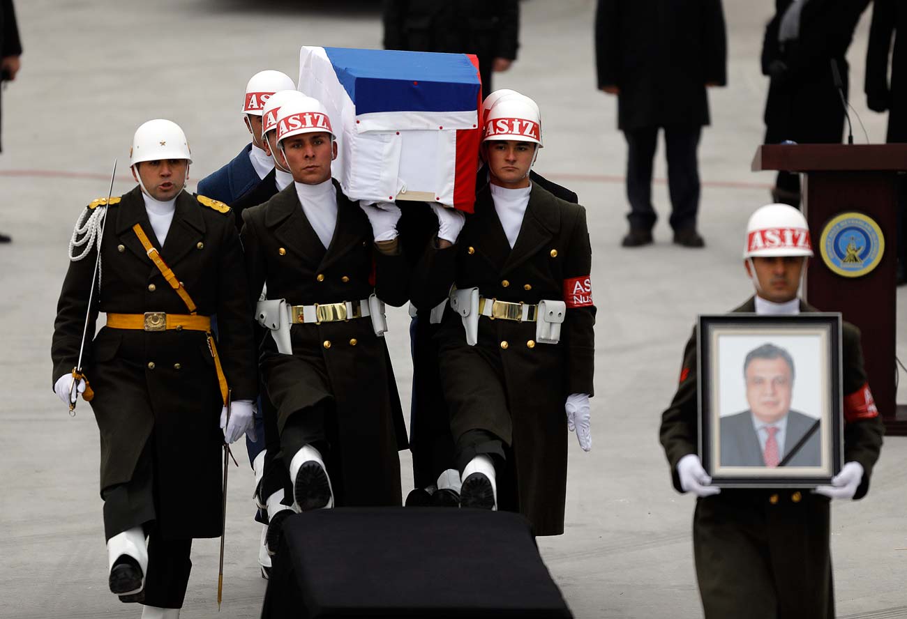 Flag-wrapped coffin of late Russian Ambassador to Turkey Andrei Karlov is carried to a plane during a ceremony at Esenboga airport in Ankara, Turkey.