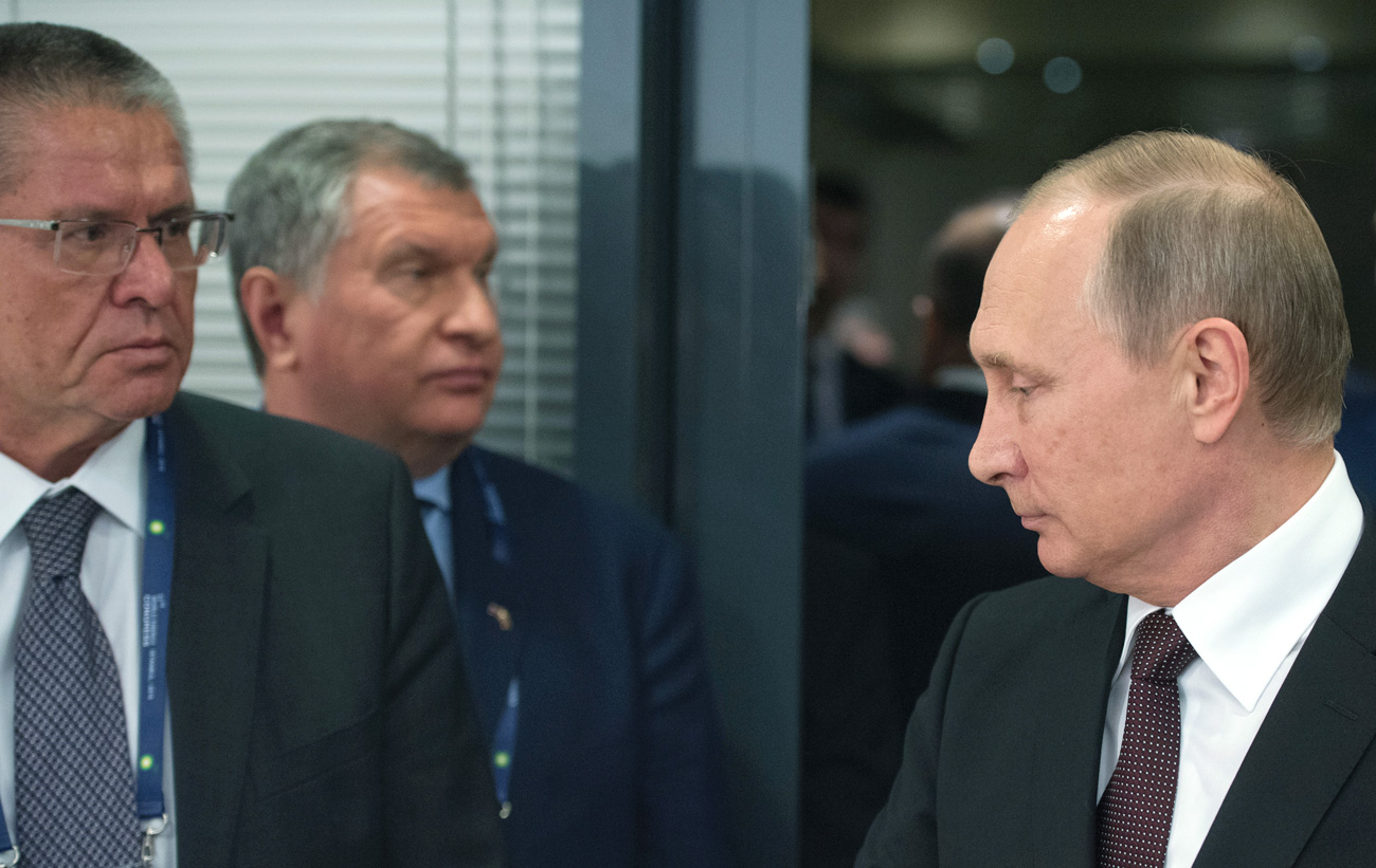 October 10, 2016. From right: Russian President Vladimir Putin, Rosneft Chief Executive Officer Igor Sechin and Economic Development Minister Alexei Ulyukayev 