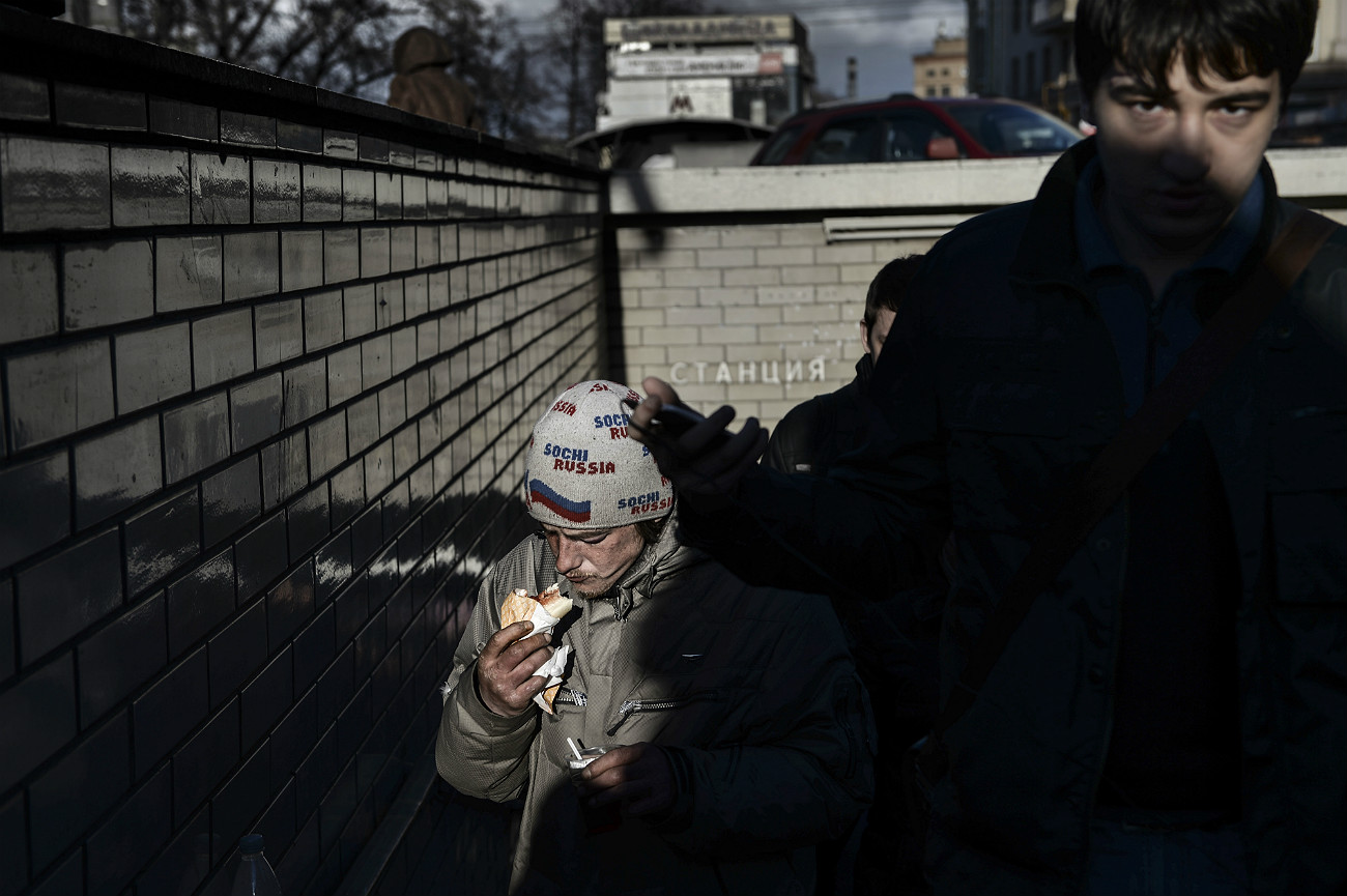 Homeless men coming out of the underpass in Moscow.