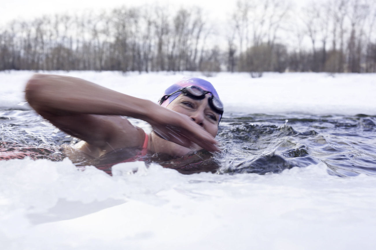 People of various ages and physical attributes immerse themselves in the water. They include marathon runners, for whom winter swimming is a way to go beyond normal physical limitations.