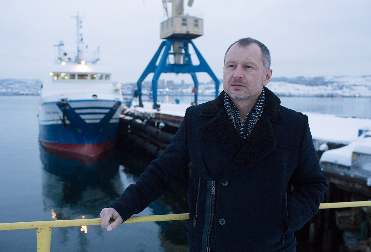 Vitaly Orlov, billionaire and chief executive officer of Norebo Holding JSC, poses for a photograph while standing on the quayside near the Yakov Gunin, a stern fishing trawler in Murmansk, Russia, Jan. 13, 2017.