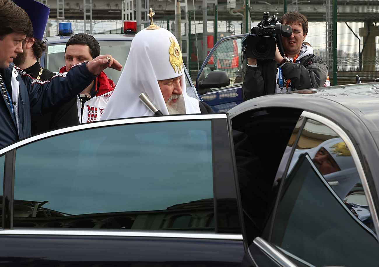 Patriarch Kirill of Moscow and all Russia steps into a car after a prayer service.
