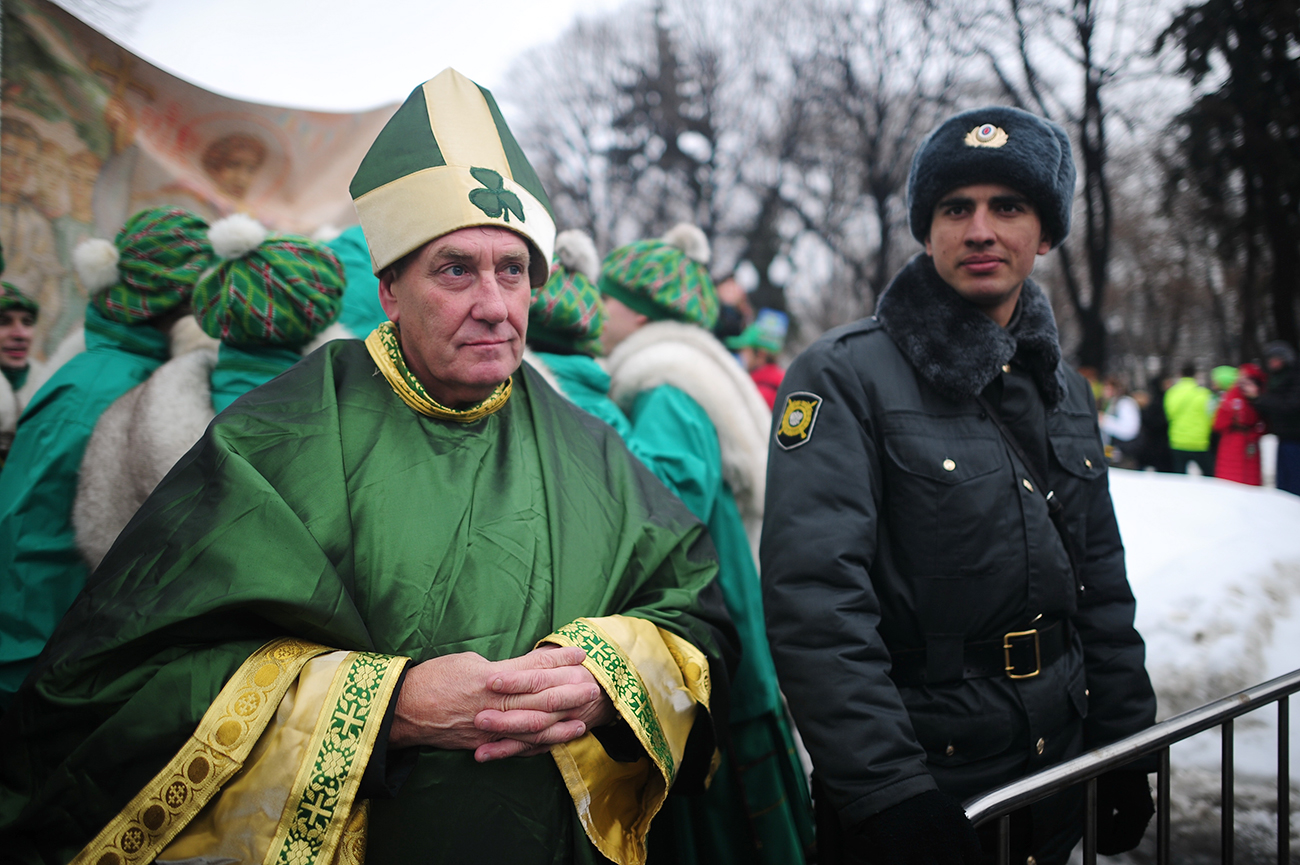 A man in a green costume takes part in a parade to celebrate St. Patrick's Day, in Moscow's Gorky Park. 
