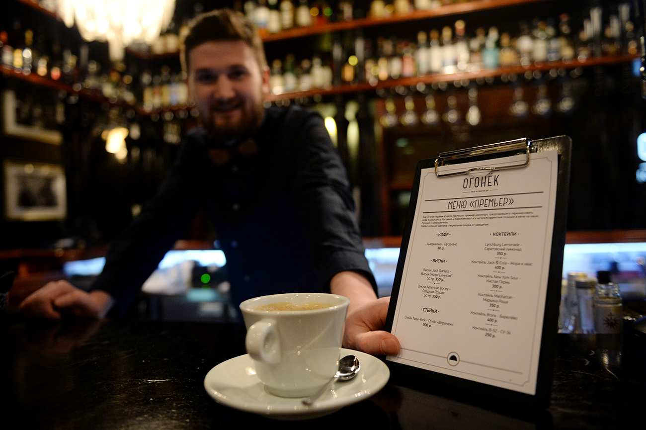 A barista serves customers in a cafe, Yekaterinburg.