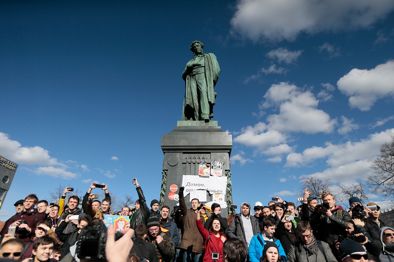 People surround Alexander Pushkin monument. On March 26, protests against corruption were held across Russia. 