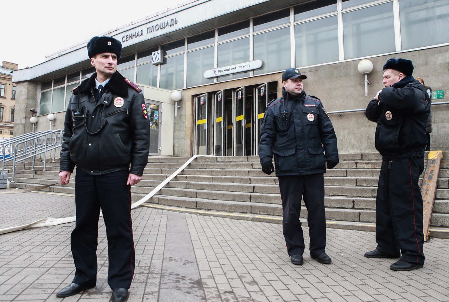 Police officers near Sennaya Ploshchad station of the St Petersburg metro in the aftermath of an explosion which occurred in a train at 2:40 p.m. Moscow time.