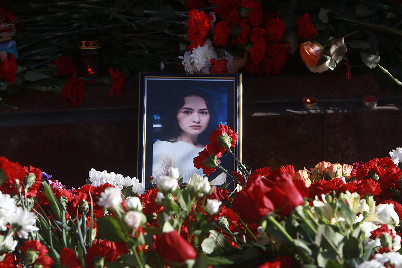Flowers and a portrait of a victim of the St Petersburg Metro explosion Dilbara Alieva.