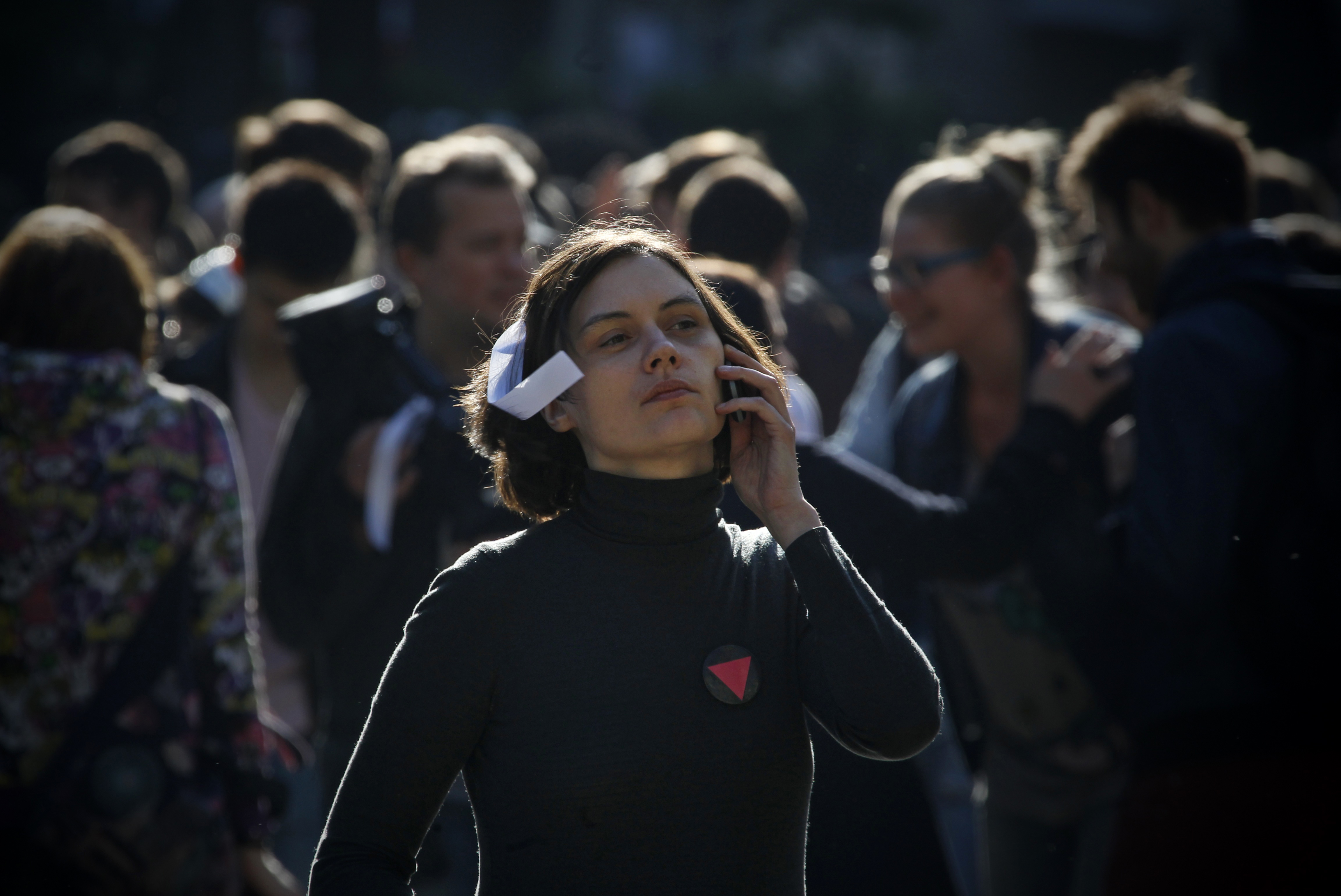 A young Russian woman  speaks on her phone