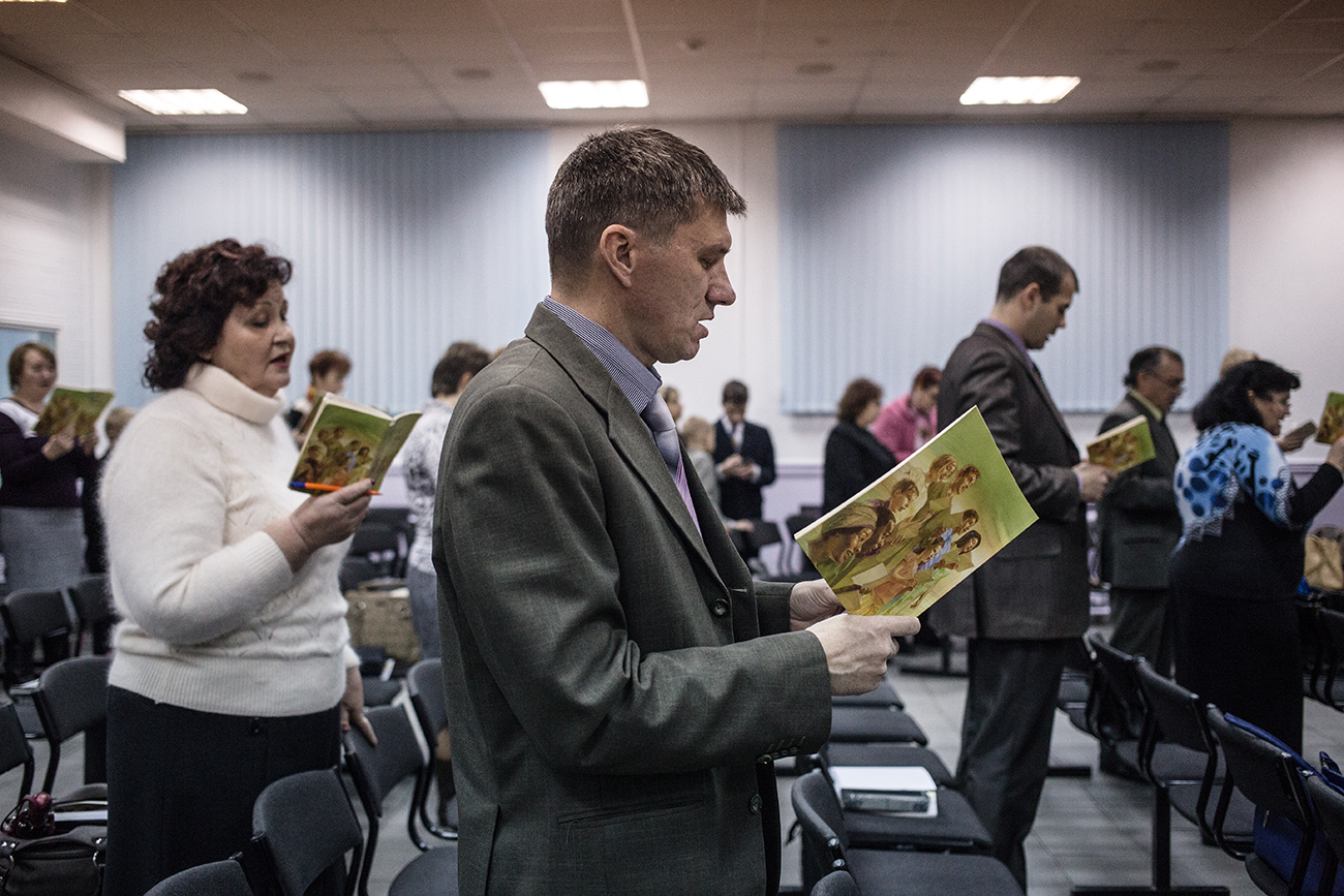 Members of Jehovah’s Witnesses attend a church service.