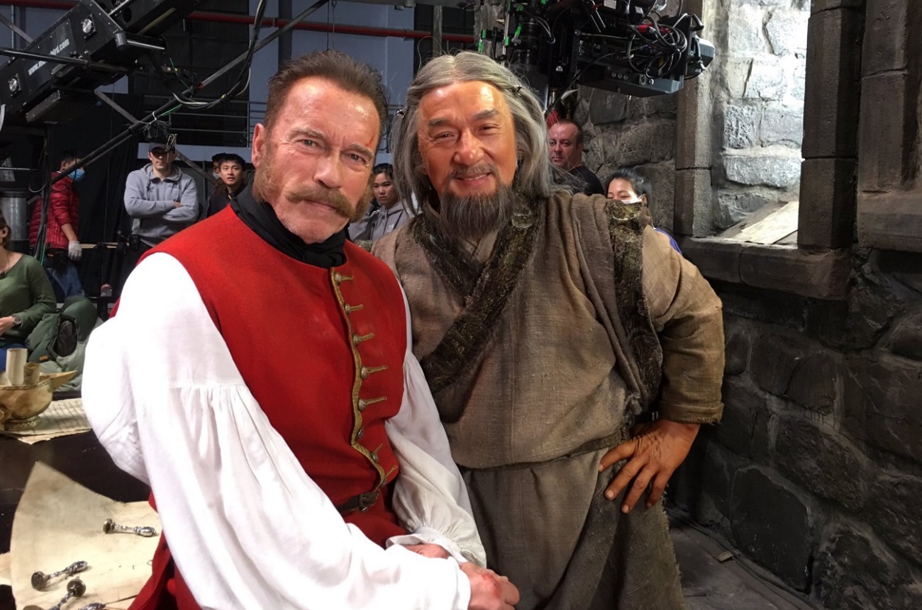 Arnold Schwarzenegger and Jackie Chan on the set of 'The Mystery of Dragon Seal: Journey to China'. Source: PLANET PHOTOS/Global Look Press