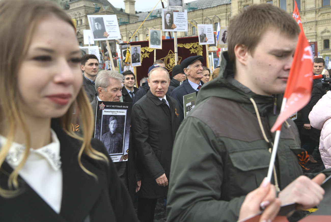 Russian President Vladimir Putin took part in the event in Moscow for the third year. The head of state appeared on Red Square with a picture of his father, a frontline soldier.