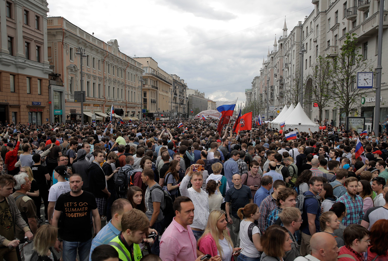 Protesters attend a demonstration in downtown Moscow, Russia, Monday, June 12, 2017. Russian opposition leader Alexei Navalny, aiming to repeat the nationwide protests that rattled the Kremlin three months ago, has called for a last-minute location change for a Moscow demonstration that could provoke confrontations with police.