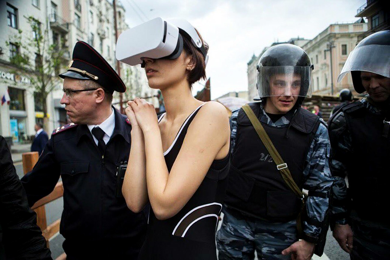 Katrin Nenasheva being detained by police.