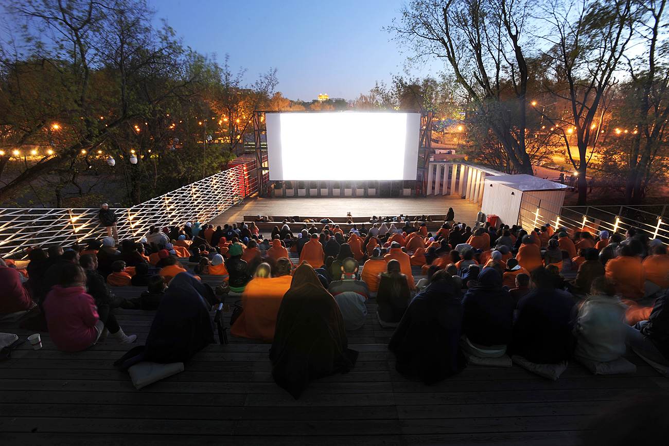 People watching a movie in a Pioner 24-hour open-air cinema in Gorky Park. 