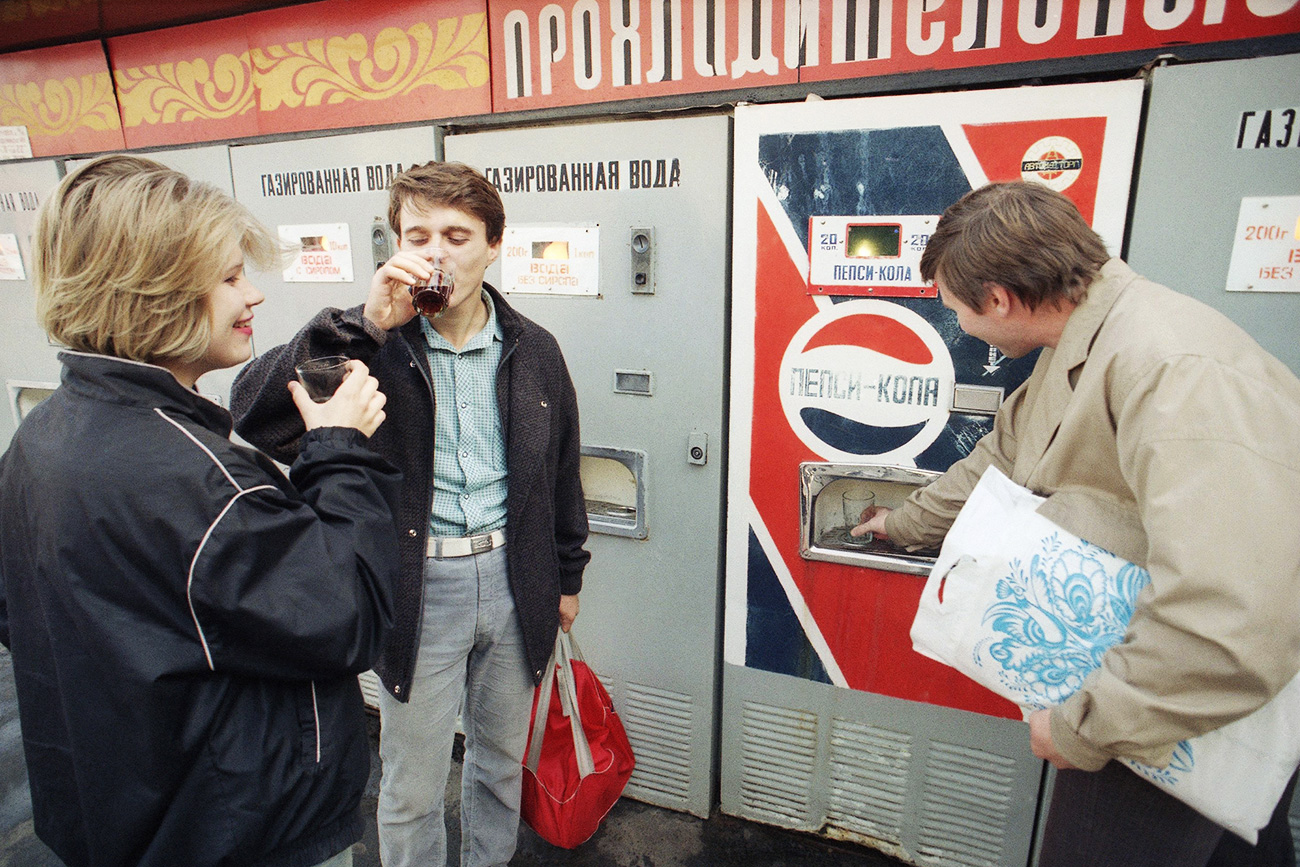 Thirsty Muscovites gather at a Pepsi Cola machine in Moscow, Friday, Sept. 6, 1991. The soda sells for 20 kopeks, about 10 cents a serving.