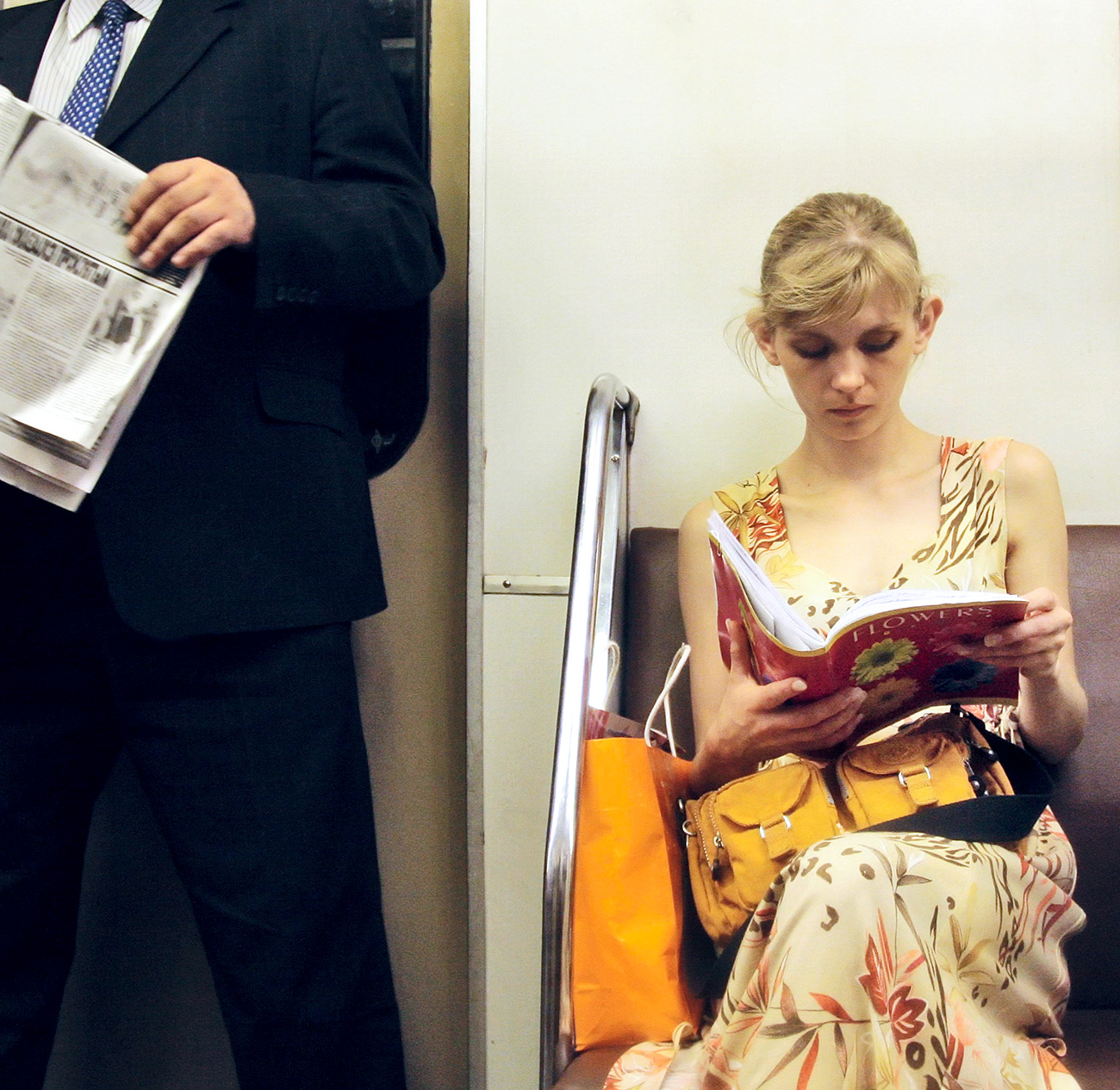 ITAR-TASS 51: MOSCOW, RUSSIA. AUGUST 24. Girl reads an exercise book on a Moscow Metro train.