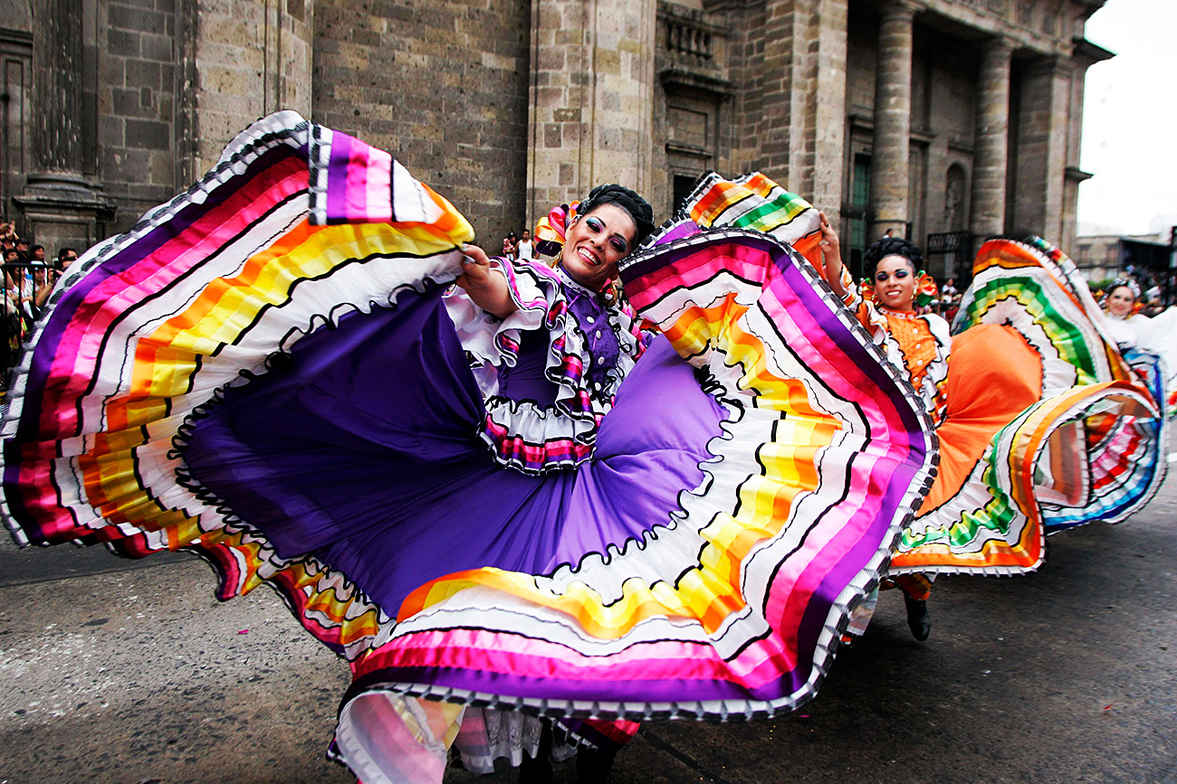 Folkloric dancers perform during the annual Charros and Mariachi parade in Guadalajara. Charros are cowboys and cowgirls, and Mariachis are traditional Mexican musicians who play songs for paying customers in public places, bars and restaurants and are renowned for their elaborate outfits and sombreros