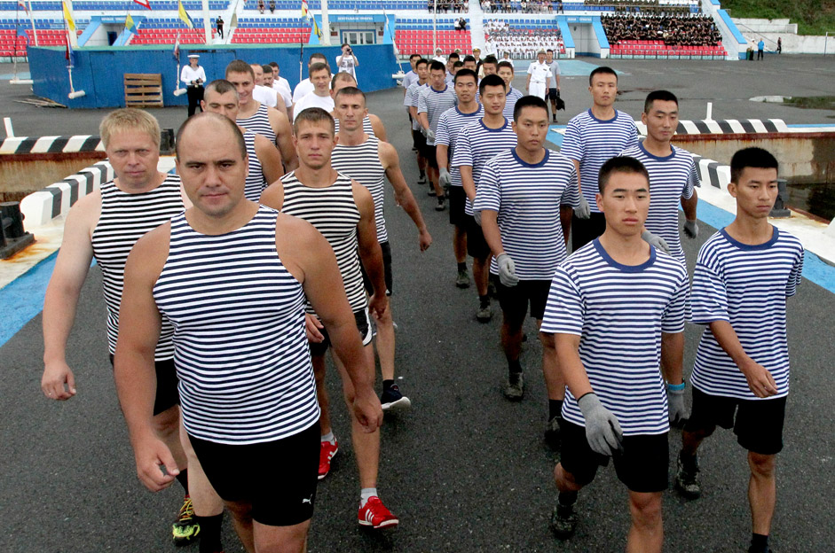 Russian and Chinese sailors at the start of the boat race in joint naval exercises in Vladivostok.