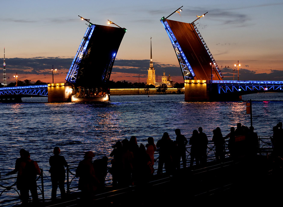 Tourists enjoy a view of the historical center of St. Petersburg, Russia, during the so-called 'White Night'