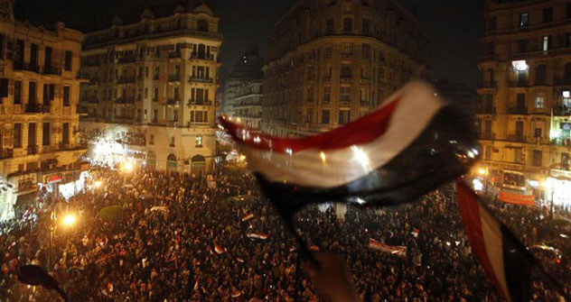 Pro-democracy supporters wave Egyptian flags during a supporters' celebration at Talaat Harb Square in Cairo February 18, 2011ю Source: Reuters